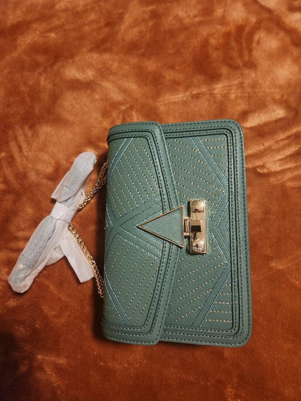 Sage green crossbody bag with metallic stitching